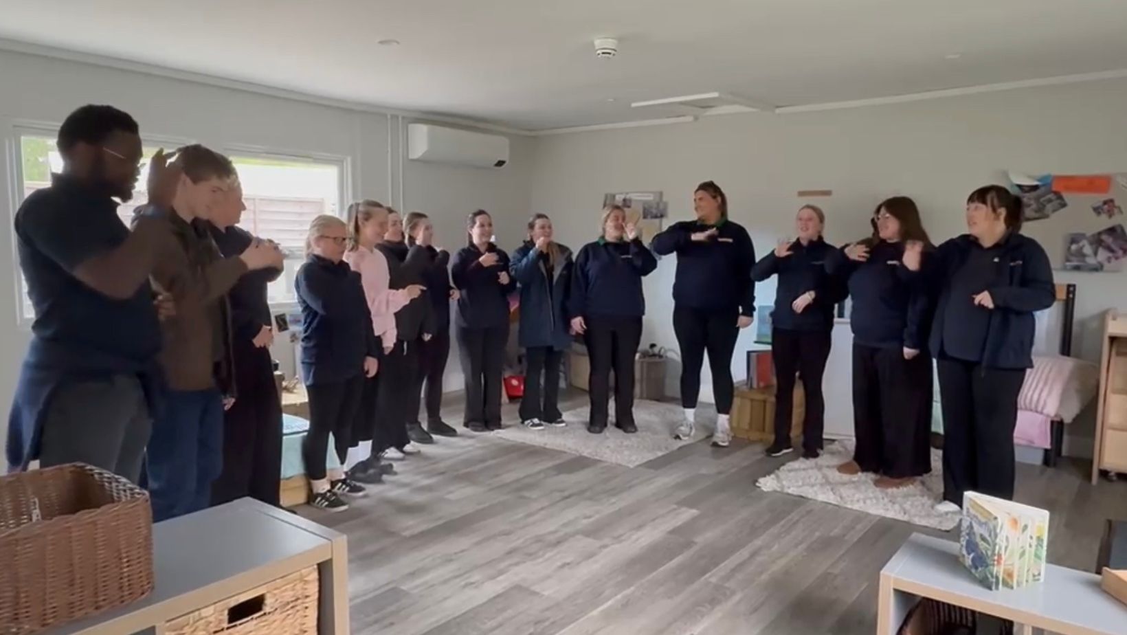 Staff at Toddletown Farnham practicing Makaton together